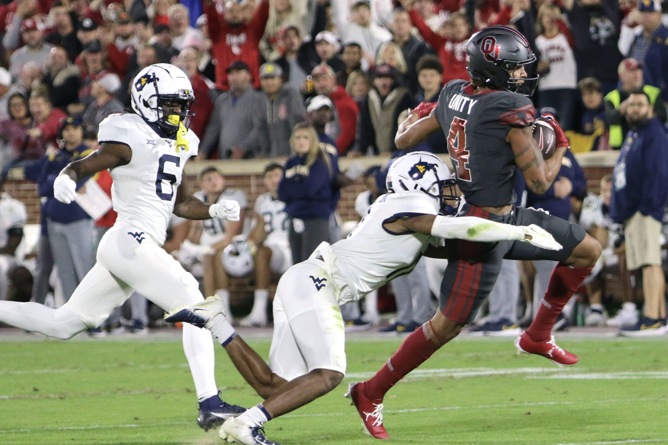 Gabriel scores school record 8 touchdowns as OU dismantles WVU 59-20